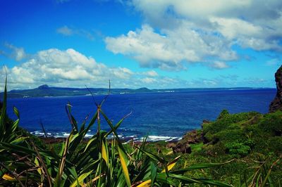 Scenic view of sea against cloudy sky