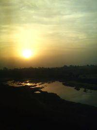 Scenic view of sunset over river