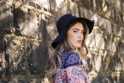 Portrait of young woman looking away