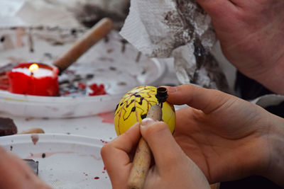 Close-up of painting easter egg