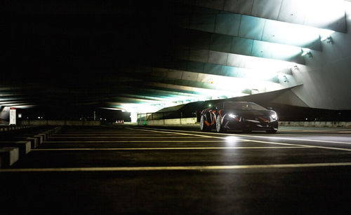 Illuminated parking lot in city at night