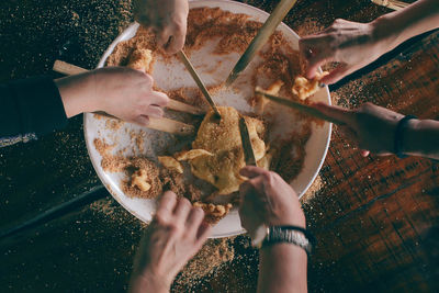 High angle view of man eating food