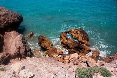 High angle view of rocks on shore