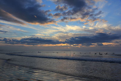 Scenic view of sea against sky at sunset