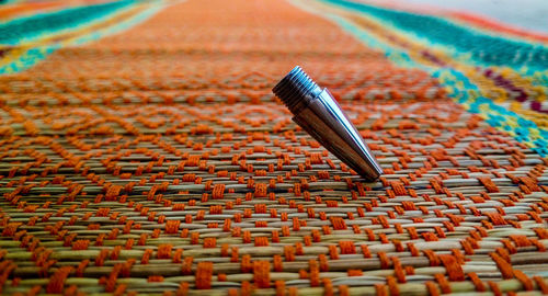 High angle view of pen nib on wood