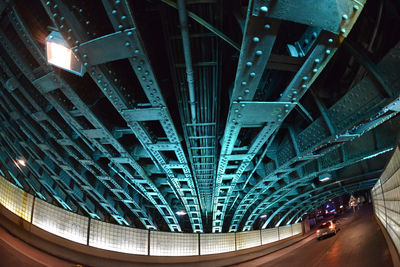 Underneath view of bridge over road in city