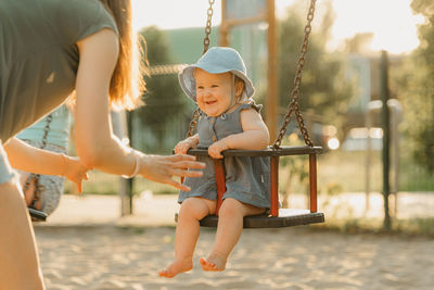 Full length of boy playing at playground