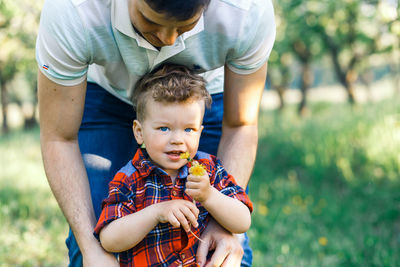 Boy holding father