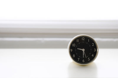 Close-up of clock against white background