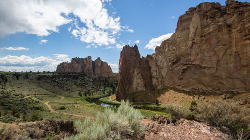 Rock formations on landscape against sky