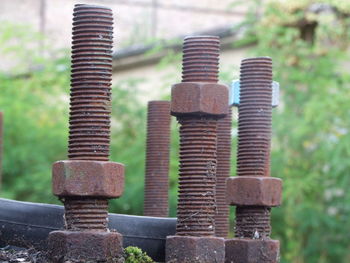 Close-up of abandoned rusty nut bolts