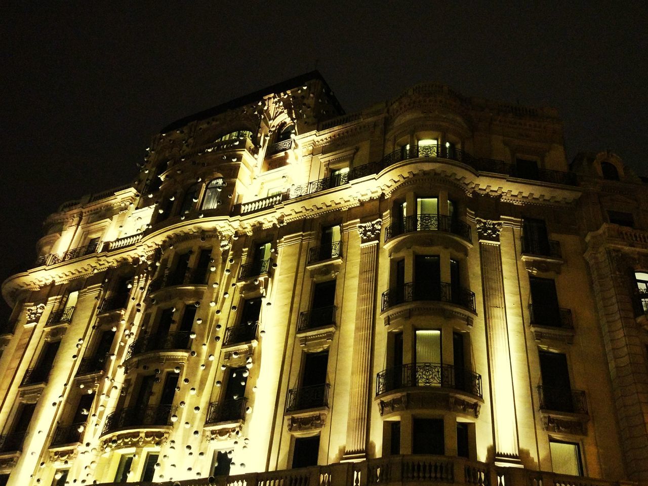 architecture, building exterior, low angle view, built structure, night, sky, travel destinations, no people, city, illuminated, outdoors