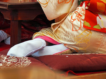 Low section of woman wearing traditional kimono