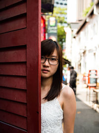 Portrait of young woman standing outdoors