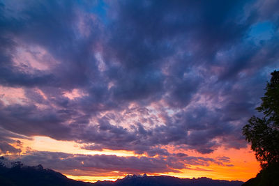 Low angle view of dramatic sky during sunset