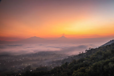 Scenic view of landscape against sky during sunset