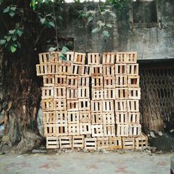 Stack of wooden crates against wall