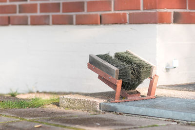 Close-up of metallic structure against wall