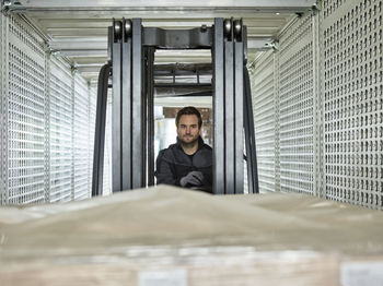 Fork-lift driver loading lorry