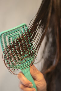 Close-up of woman holding illuminated light bulb