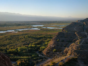 High angle view of river amidst landscape against sky