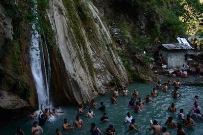 High angle view of people on rocks