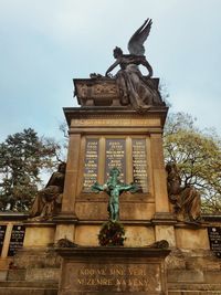 Low angle view of statue against sky