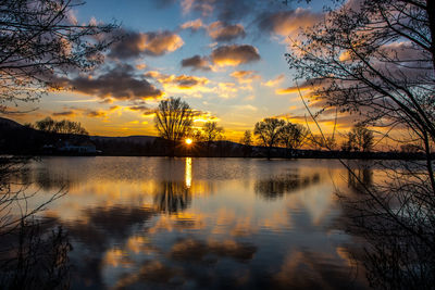 Scenic view of lake against orange sky