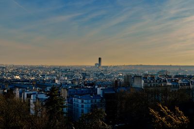 Cityscape against sky during sunset