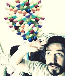 Portrait of man with balloons