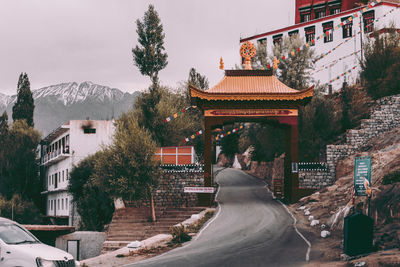 Panoramic view of trees and buildings against sky