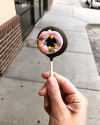 Midsection of person holding ice cream cone