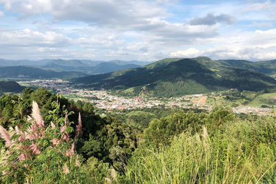 Scenic view of landscape and mountains against sky