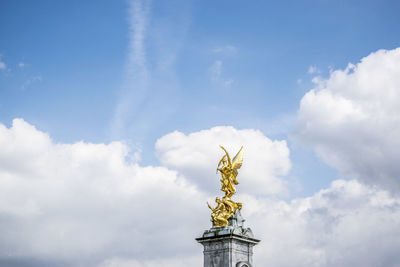 Low angle view of statue against sky