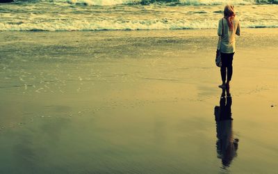 Woman standing in water