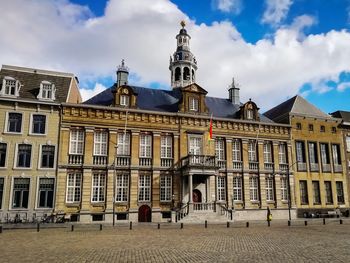 View of old building against cloudy sky