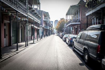 Vehicles on road along buildings