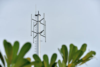 Close-up of communications tower against sky