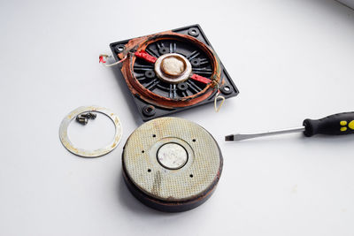 High angle view of camera on table against white background