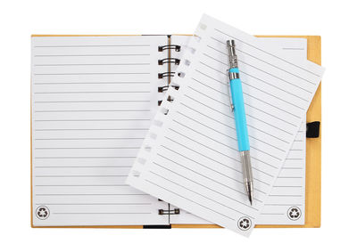 High angle view of pen on paper against white background