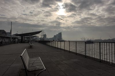View of bridge over sea against cloudy sky