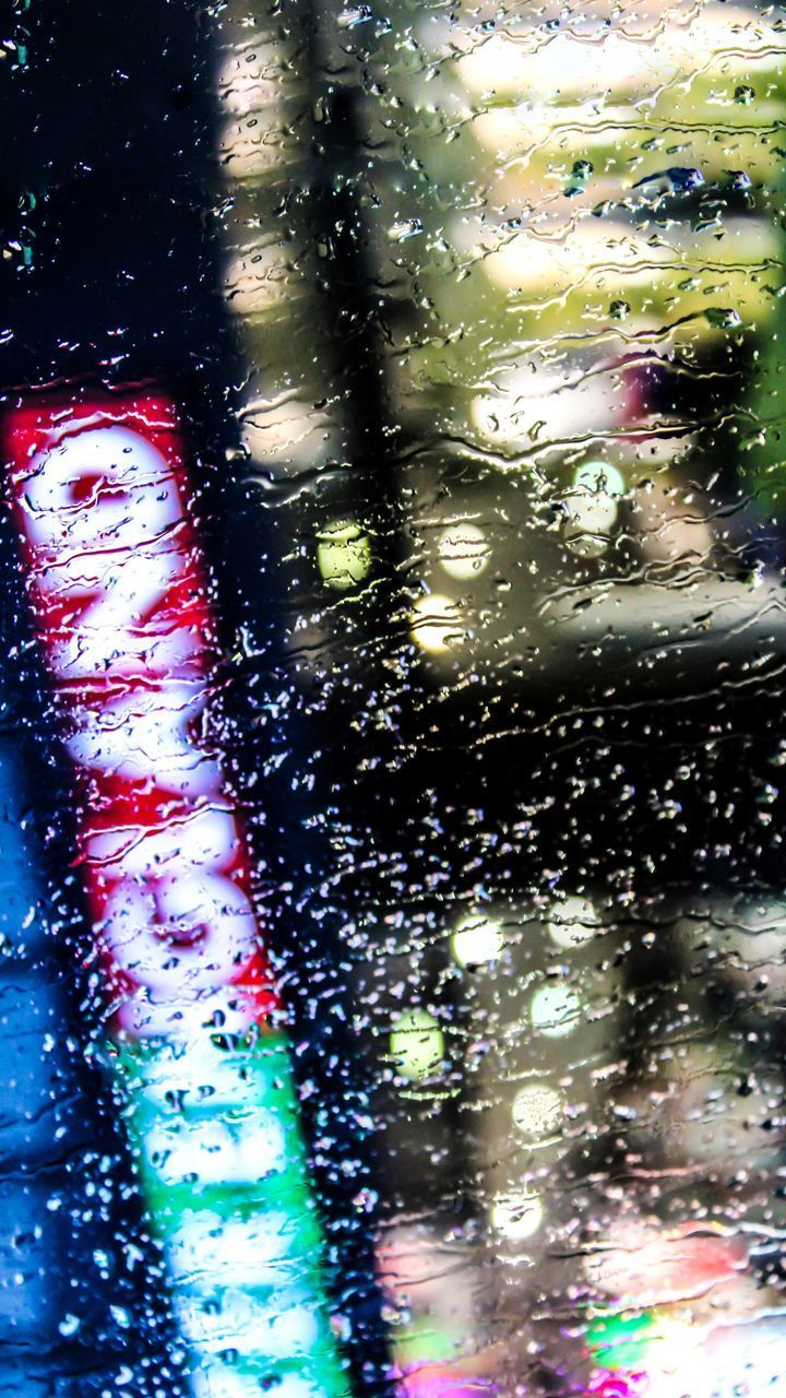 CLOSE-UP OF WET GLASS WINDOW