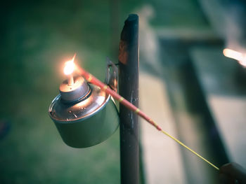 Close-up of burning candles