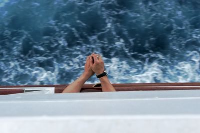 Person smoking on ship