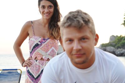 Portrait of smiling young woman on beach