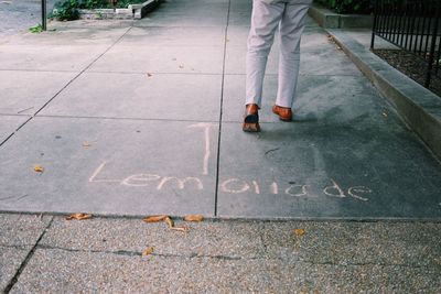 Woman standing on sidewalk