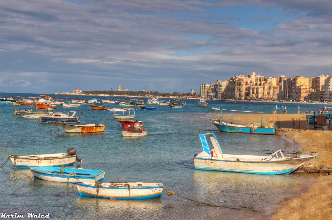 BOATS SAILING ON HARBOR