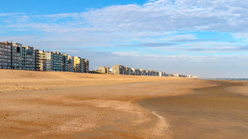 View of beach against cloudy sky