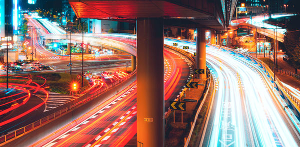 High angle view of light trails on road at night