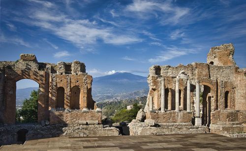Antique theater in taormina with etna in the background 